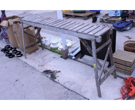 A VINTAGE HATHERLEY WOODEN FOLDING TRESTLE TABLE