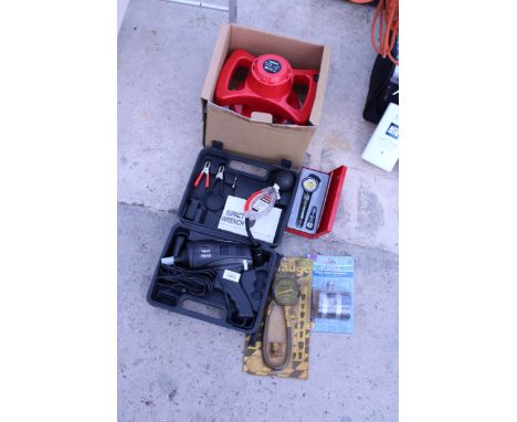 AN ASSORTMENT OF CAR ITEMS TO INCLUDE AN ELECTRIC BUFFER, AN IMPACT WRENCH AND PRESSURE GUAGES ETC