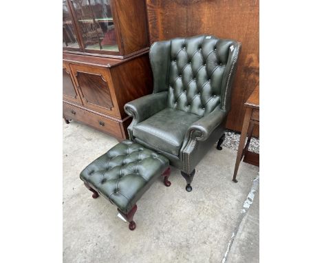 A GREEN LEATHER BUTTON-BACK WINGED FIRESIDE CHAIR ON CABRIOLE LEGS AND MATCHING STOOL