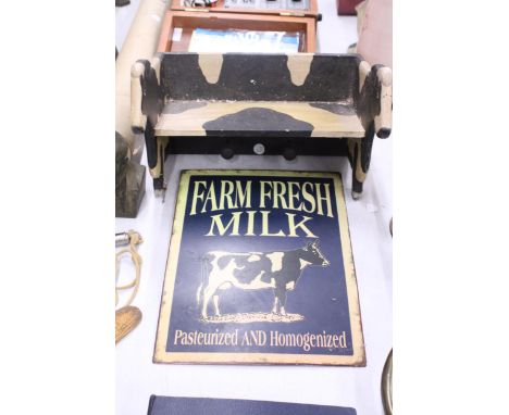 A WOODEN SHELF IN THE SHAPE OF A COW PLUS A 'FARM FRESH MILK' SIGN