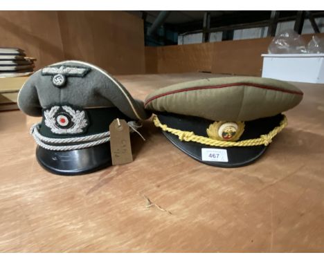 A VINTAGE BULGARIAN SOCIALIST CAP AND GERMAN CAP