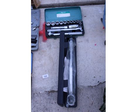 A 1/2" DRIVW TORQUE WRENCH AND A SOCKET SET