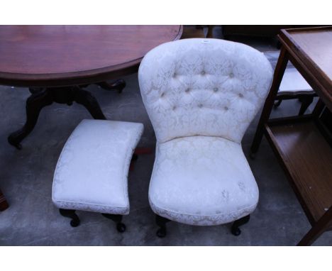 A BUTTON-BACK UPHOLSTERED LOW CHAIR AND MATCHING STOOL ON CABRIOLE LEGS