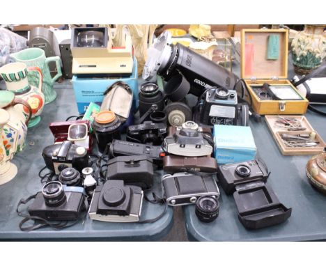 A LARGE LOT OF VINTAGE CAMERAS AND LENSES