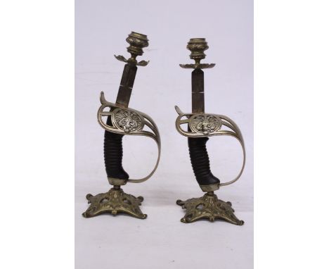 A PAIR OF VINTAGE PRUSSIAN SWORD CANDLE STICKS HEIGHT 29CM
