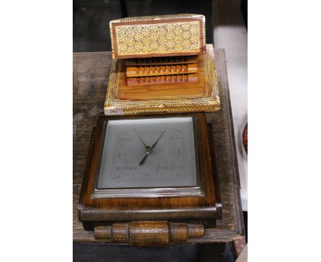 A MOORISH STYLE CIGARETTE BOX AND AN ART DECO BAROMETER