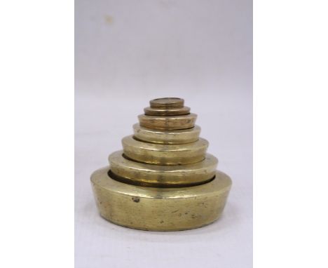 A VINTAGE SOLID BRASS WEIGHT SET