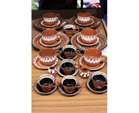 A QUANTITY OF VINTAGE GERMAN STUDIO POTTERY CUPS, SAUCERS AND PLATES