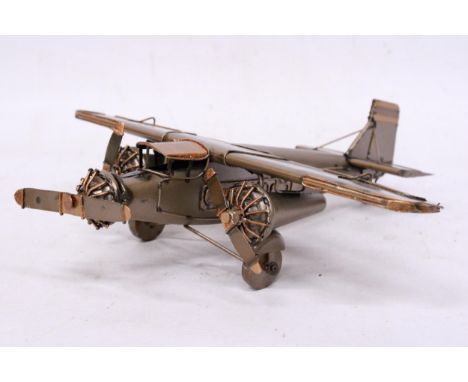 A TIN PLATE THREE ENGINE AEROPLANE