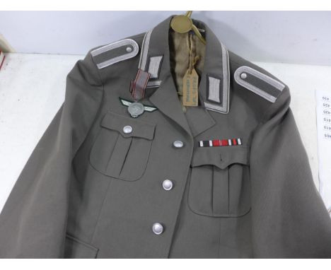 A NAZI GERMANY WORLD WAR II LUFTSCHUTZ (AIR DEFENCE) MEDAL, SECOND CLASS, A PROPS DEPARTMENT WERMACHT JACKET