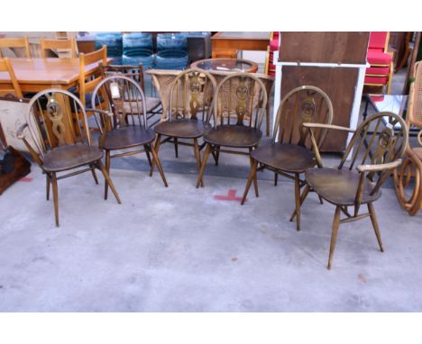 A SET OF SIX ERCOL FLEUR DE LYS DINING CHAIRS, TWO BEING CARVERS