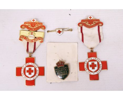 TWO VINTAGE RED CROSS MEDALS AND TWO ENAMEL HOSPITAL BADGES