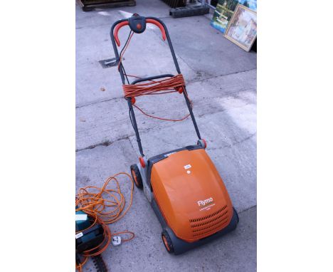AN ELECTRIC FLYMO LAWNRAKE COMPACT 3400