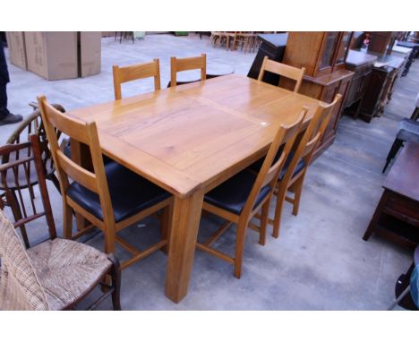 AN OAK DINING TABLE, 71" X 35" AND SIX MATCHING LADDER-BACK DINING CHAIRS