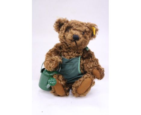 A STEIFF 'GARDENER' SATURDAY TEDDY BEAR WITH APRON AND WATERING CAN AND BUTTON IN THE EAR