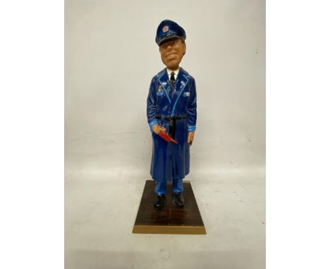 AN ESSO FORECOURT ATTENDANT FIGURE ON A WOODEN PLINTH MADE IN ENGLAND 56159 - 54 CM NOT INCLUDING THE BASE