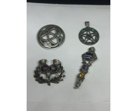FOUR ITEMS OF CELTIC JEWELLERY TO INCLUDE A KILT PIN, THISTLE BROOCH, PEWTER BROOCH AND A GREEN STONE PENDANT