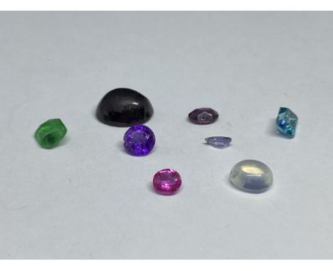 A QUANTITY OF GEMSTONES TO INCLUDE RUBY, TOURMALINE, AMETHYST, TOPAZ ETC TOTAL WEIGHT 11.5 CARATS. THE VENDOR STATES THAT ALL