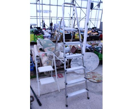 A FIVE RUNG ALUMINIUM STEP LADDER AND A FURTHER STEP LADDER