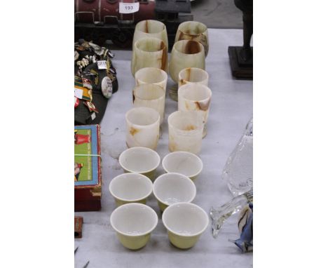 A QUANTITY OF VINTAGE ONYX CUPS WITH CERAMIC TOYOTA EGGCUPS