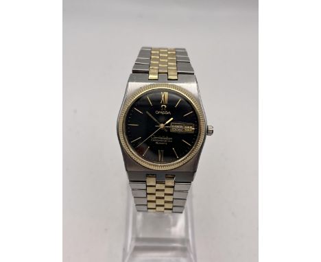 A GENTLEMAN'S VINTAGE OMEGA CONSTELLATION CHRONOMETER QUARTZ WRIST WATCH, TWO TONE ORIGINAL BRACELET. DAY AND DATE.