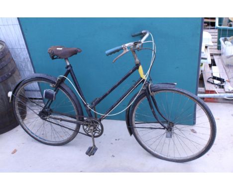 A VINTAGE RALIEGH BICYCLE COMPLETE WITH A LEATHER BROOKS SADDLE