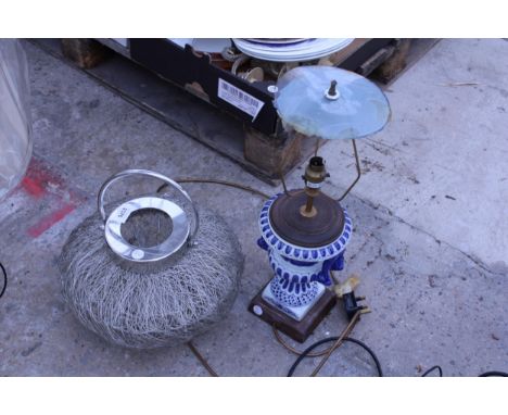 A BLUE AND WHITE CERAMIC TABLE LAMP AND A FURTHER CANDLE HOLDER