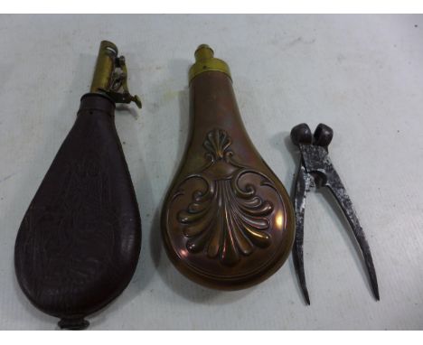 A VINTAGE COPPER AND BRASS POWDER FLASK, A SHOT FLASK AND A BULLET MOULD