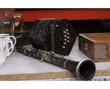 A VINTAGE CONCERTINA TOGETHER WITH A CLARINET