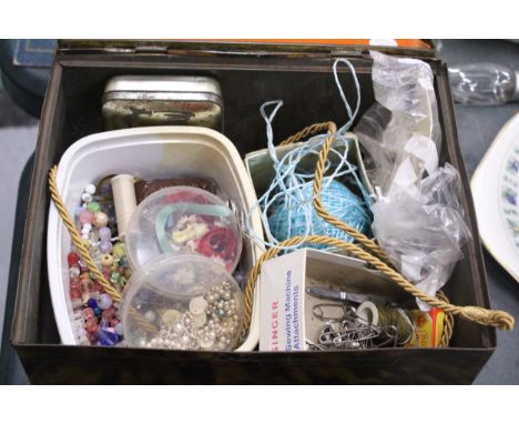 A LARGE VINTAGE 'BLUE BIRD' TIN CONTAINING JEWELLERY FINDINGS, ETC