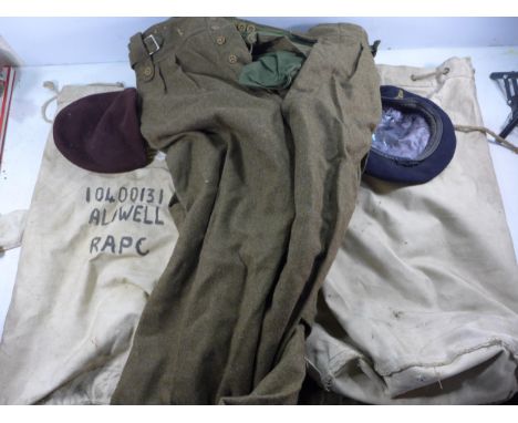 TWO MID 20TH CENTURY ARMY KITBAGS WITH CONTENTS TO INCLUDE TWO BERETS, TROUSERS ETC
