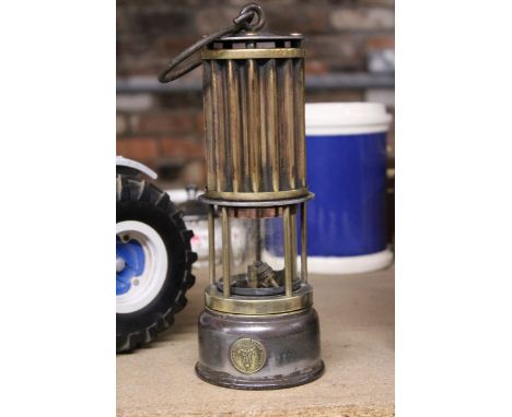 A VINTAGE BRASS AND METAL MINERS LAMP