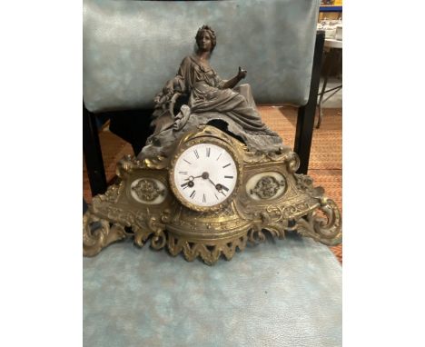 A VINTAGE GILT CLOCK WITH METAL FIGURE TO THE TOP - A/F