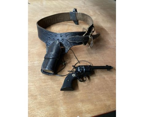 A BLANK FIRING LATE 20TH CENTURY SINGLE ACTION ARMY REVOLVER AND BLACK LEATHER HOLSTER
