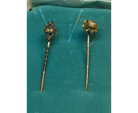 TWO MARKED 15 CARAT GOLD STICK PINS BOTH WITH SEED PEARLS