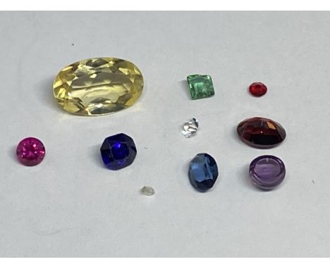 A QUANTITY OF GEMSTONES TO INCLUDE CITRINE, AMETHYST, SAPPHIRE, EMERALD, GARNET, RUBY ETC TOTAL WEIGHT 7.1 CARAT. THE VENDOR 