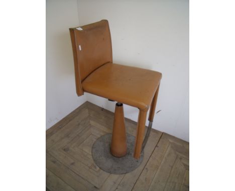 Unusual industrial style leather upholstered swivel bar stool  