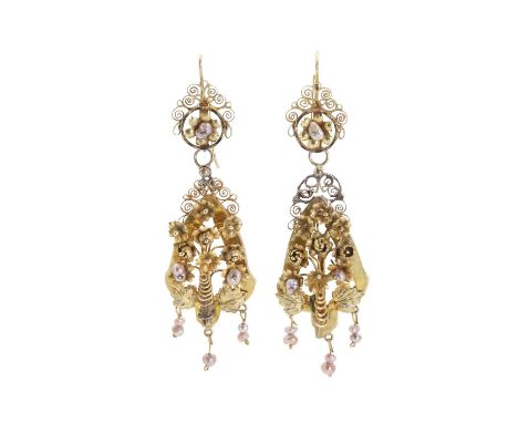 A pair of early Victorian articulated drop earrings, each headed by a filigree panel with a spinning floral motif, suspending