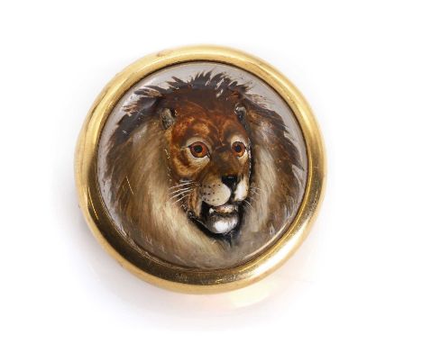 An early 20th century reverse painted intaglio or Essex crystal lion brooch, the crystal carved with the realistic portrait o