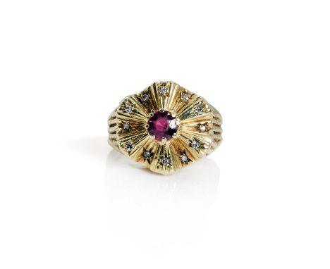 An 18ct gold garnet and diamond dress ring, c.1960,  centring on a round mixed cut rhodolite garnet claw set to an undulated 