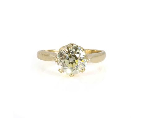 An 18ct gold fancy coloured diamond solitaire ring,  with a large fancy light yellow old European cut diamond, with a stated 