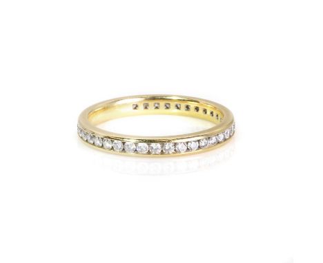 A diamond eternity ring,  set with round brilliant cut diamonds, total diamond weight approximately 0.40-0.50ct, channel set 