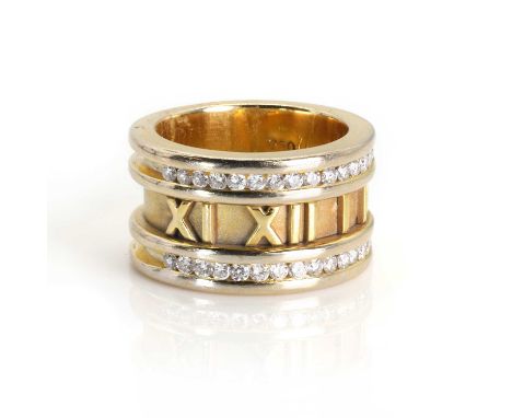 A diamond set 'Atlas' style ring,  with raised Roman numerals to a sand blast ground. Two rows of brilliant cut diamonds, cha