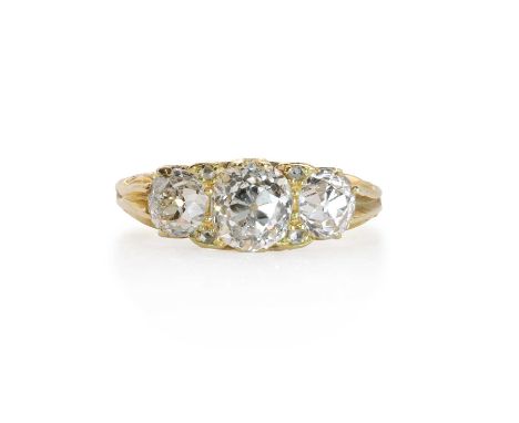 A late Victorian diamond three stone ring,  the three graduated old mine cut diamonds, interspaced with diamond chips, all cl