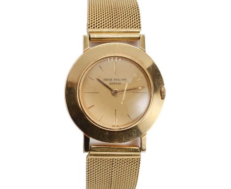 A gentlemen's 18ct gold Patek Philippe Geneve mechanical bracelet watch, c.1960,  ref. 2594. A circular case with a polished 