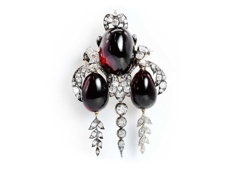 A Victorian carbuncle garnet and diamond brooch, composed of a trio of oval cabochon foiled garnets in closed back collets, w