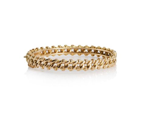 A 15ct gold hinged bangle, formed of hollow gold fancy chain links mounted on hinged curved bars, to a concealed box clasp an