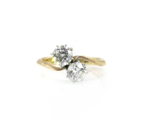A Toi Et Moi diamond ring, set with two old European cut diamonds, total diamond weight estimated as 1.00ct, each claw set to