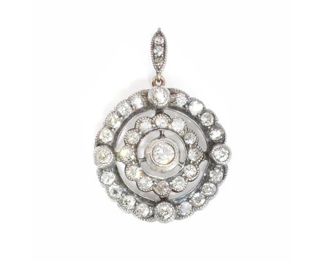 A Victorian diamond cluster pendant, of target design, comprising a principal old mine diamond collet set to the centre, two 