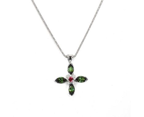 An 18ct white gold green tourmaline, ruby and diamond pendant, the cruciform pendant with a round cut ruby collet set to the 
